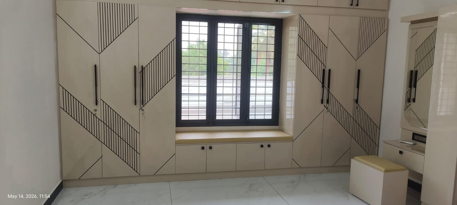 Wardrobe and furniture work by Aadhi Interiors